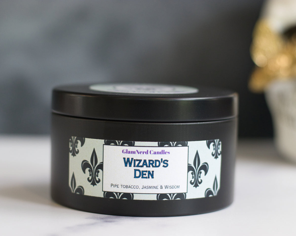 picture of Wizard&#39;s Den candle in a black tin sitting on a white marble surface